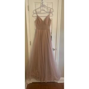 La Femme tulle A-line gown with pockets. Bodice features a sheer design. A29.